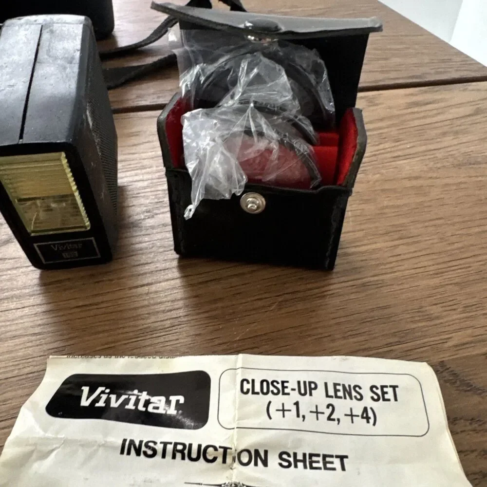 vintage Vivitar hard-sided black camera case And Vivitar camera accessory lot